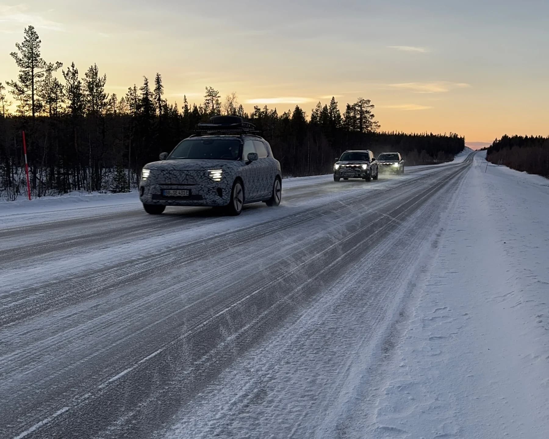 Camouflaged smart #5 prototype and test vehicles on a snowy road